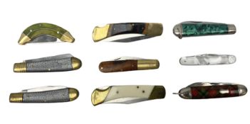 Nine pocket knives including two Ravi folding knives