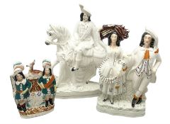 Staffordshire figures comprising one example modelled as a hunter on horseback with a stag draped a