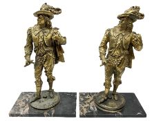 Pair of Cavaliers stood upon black marble bases