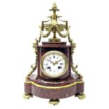 Late 19th century French Royal rouge marble and ormalu mantle clock of shaped bow front form