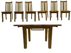Distressed look oak table with butterfly extending mechanism and six matching chairs