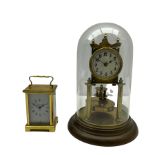 An unmarked late 19th century 400-day torsion clock under a glass dome