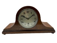 A light oak cased Tambour clock with a German 8-day movement sounding the quarters and hours on gong