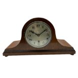 A light oak cased Tambour clock with a German 8-day movement sounding the quarters and hours on gong