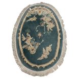 Chinese washed woollen oval dragon rug