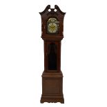 A 20th century three train longcase clock in a mahogany finished case with a swan neck pediment in t