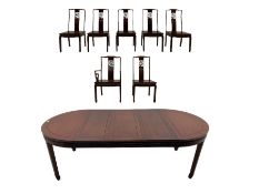 Hardwood oval extending dining table with two leaves