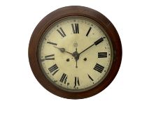 An early 20th century English wall clock with a circular 16” mahogany wooden bezel
