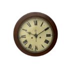 An early 20th century English wall clock with a circular 16” mahogany wooden bezel