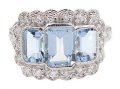 18ct white gold milgrain set three stone emerald cut aquamarine and round brilliant cut cluster ring