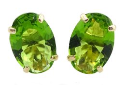 Pair of 9ct gold oval green stone stud earrings