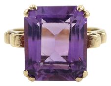 Gold single stone amethyst ring with scroll design shoulders and heart gallery