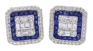 Pair of 18ct white gold round brilliant and baguette cut diamond and vari-cut sapphire cluster stud