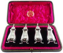 Set of four Edwardian silver peppers