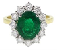 18ct gold oval emerald and round brilliant cut diamond cluster ring