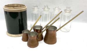 Set of four graduating copper ladles