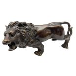 Cast metal figure of a lion