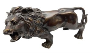 Cast metal figure of a lion