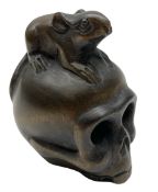 Netsuke in the form of a rat sitting on a skull