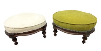 Two upholstered mahogany footstools with turned legs