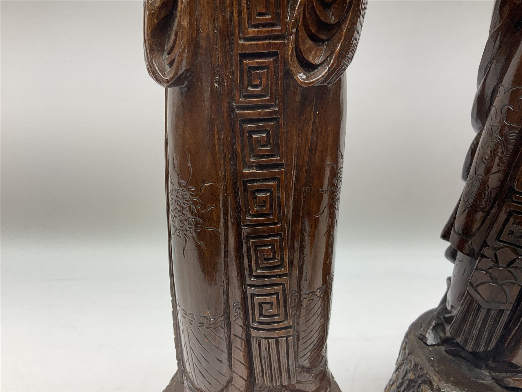 Two large hardwood Oriental figures carved as a man and woman donning robes upon naturalistic plinth - Image 4 of 19