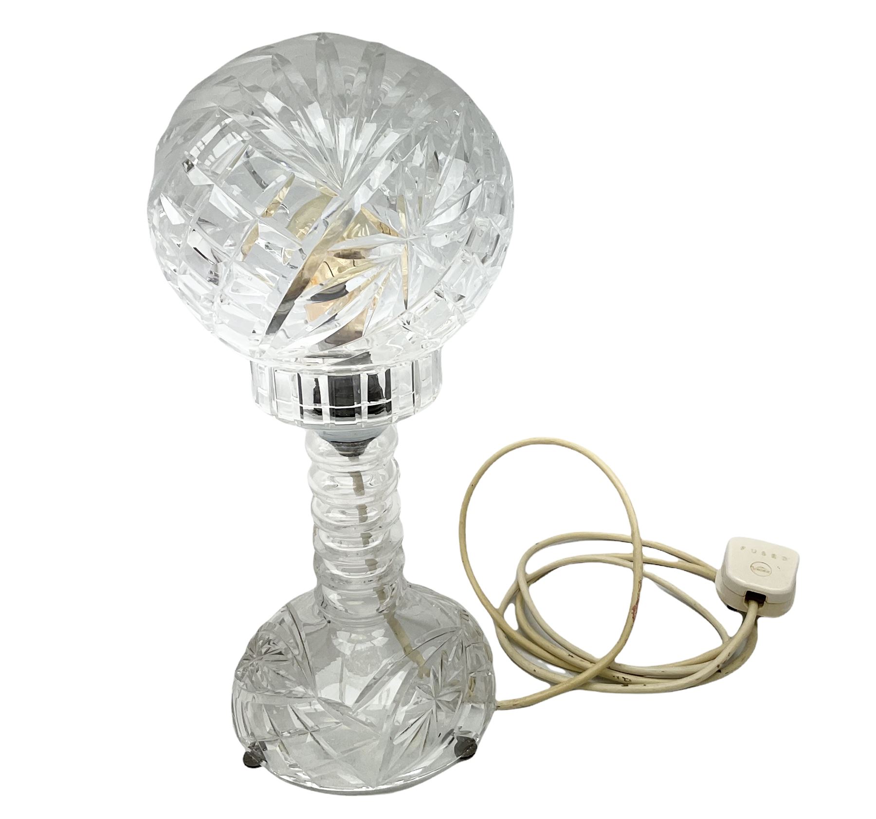 A clear cut glass table lamp