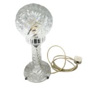 A clear cut glass table lamp