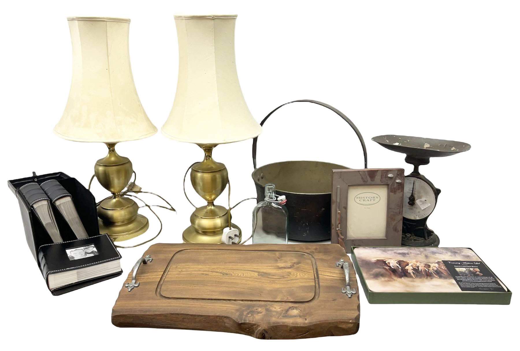 Two brassed table lamps with cream shades