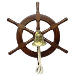 Modern six spoke ships wheel with brass bell