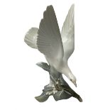 Lladro figure modelled as white dove perched upon a branch