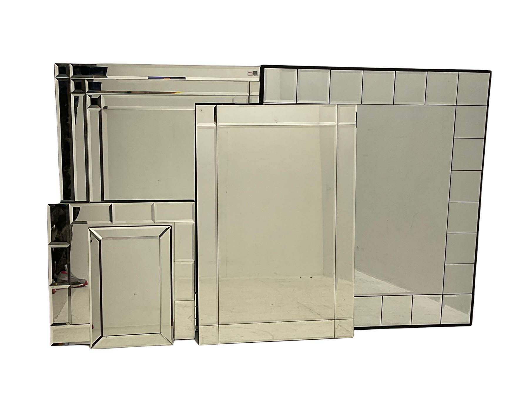 Five frameless multi-pane bevelled wall mirrors