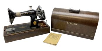 Singer sewing machine no. EA584046 in case (missing key) and Singer Manual of Family Sewing Machines