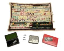 Victorian sampler worked with the alphabet by Carrie Monkman 1886