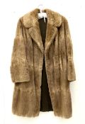 Ladies light brown three quarter length musquash fur coat