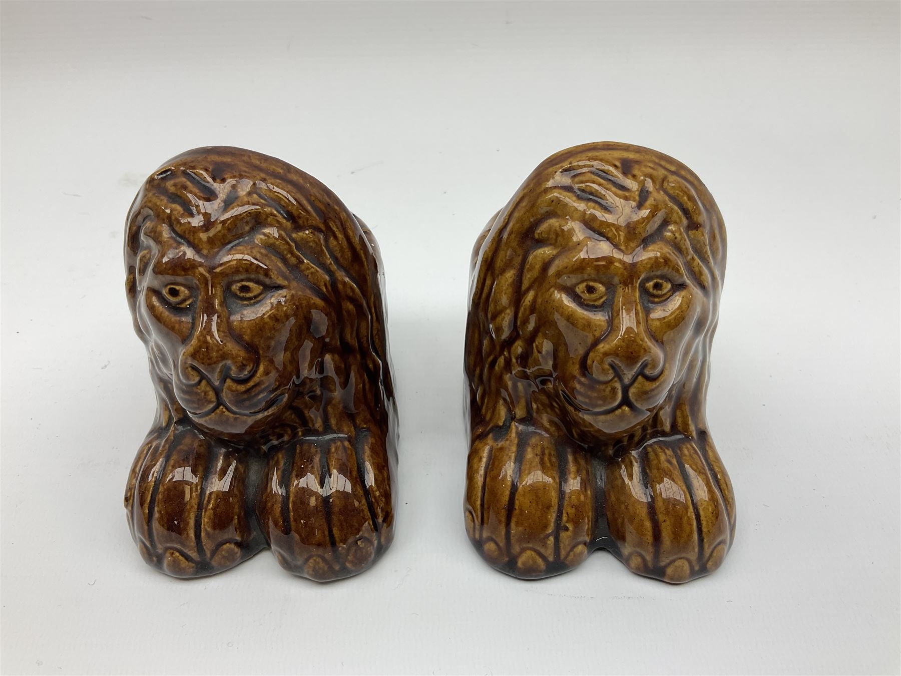 Set of four 19th century treacle glaze furniture/sash window rests modelled as lions - Image 9 of 13
