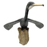 Wooden sculpture of Cormorant aquatic bird on a naturalistic wooden plinth