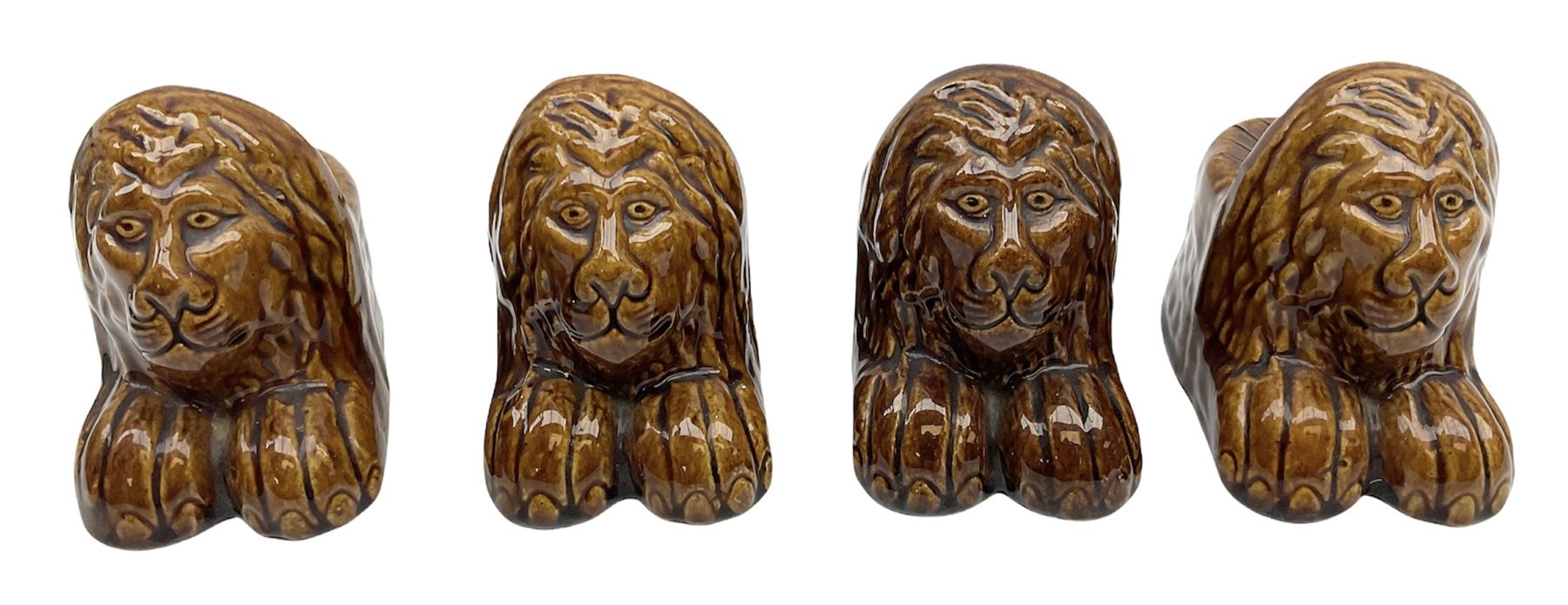 Set of four 19th century treacle glaze furniture/sash window rests modelled as lions - Image 2 of 13