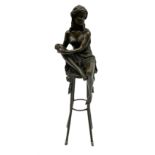 Art Deco style bronze modelled as a female figure with knee raised