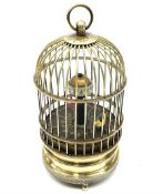 Automation bird cage of predominantly brass construction with central rotating orb and bird with pai