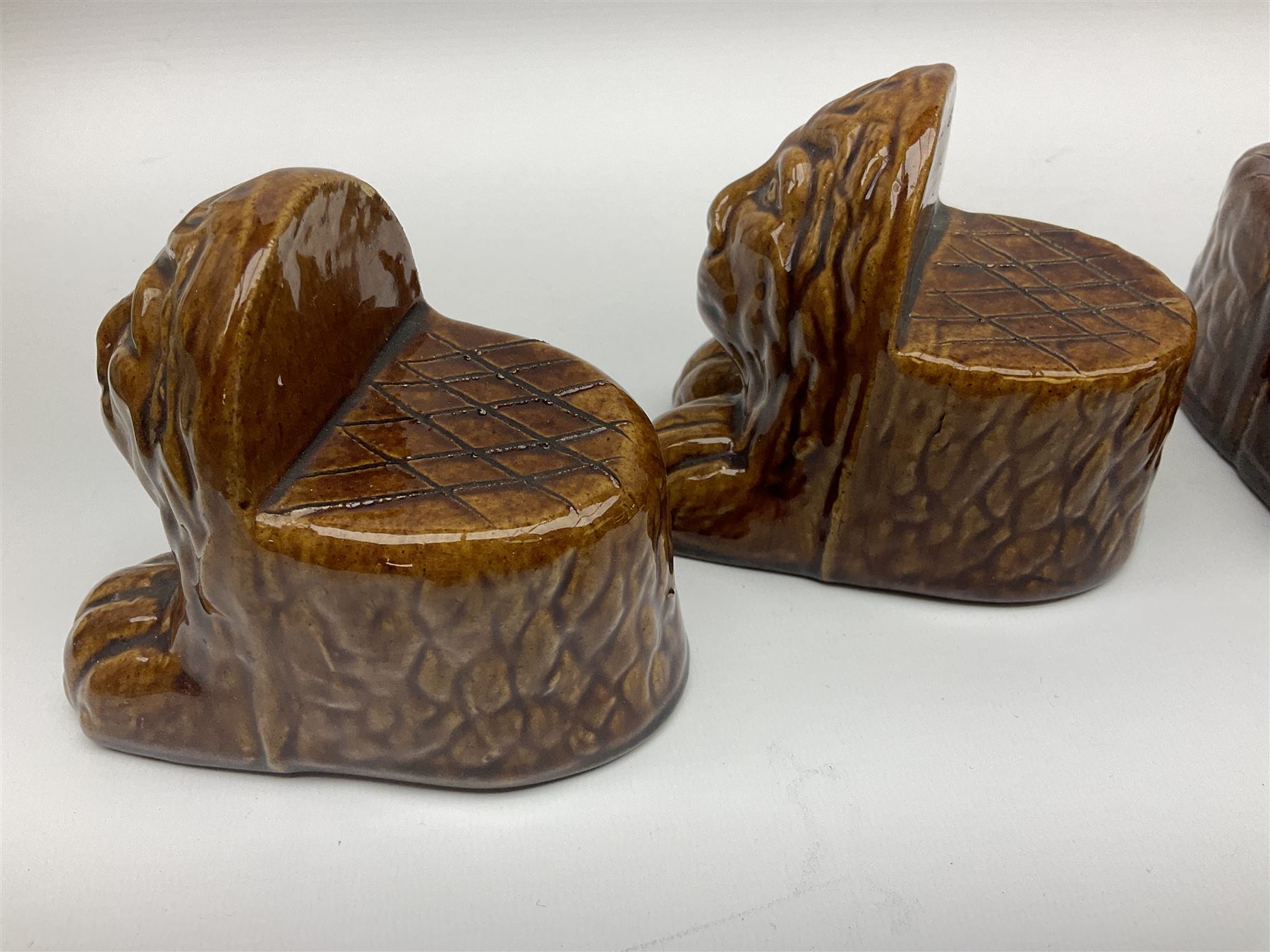 Set of four 19th century treacle glaze furniture/sash window rests modelled as lions - Image 6 of 13