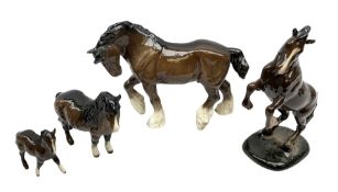 Four Beswick horses in bay