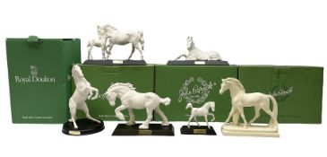 Five Beswick and Royal Doulton horse figures in matt white on black plinths