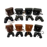 Eight cased pairs of binoculars