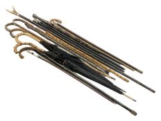 Collection of Victorian and later walking sticks and canes to include five silver mounted examples w
