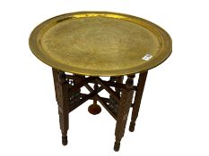 Benares carved hardwood table with brass top