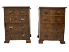 Pair of figured walnut four drawer chests
