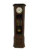 A mid-20th century weight driven floor standing clock in an oak case with canted glazed panels