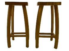 Pair light oak bar stools with dished seats