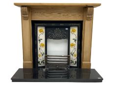 Complete fireplace - pine surround with ornate cast iron inset with Art Nouveau style floral tiles