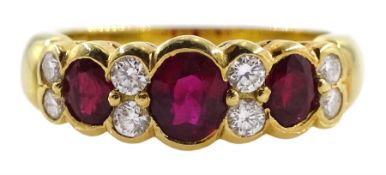 18ct gold three stone oval ruby and eight stone round brilliant cut diamond ring